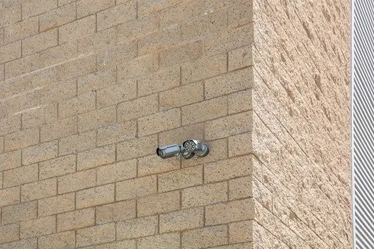 Security camera on side of facility.