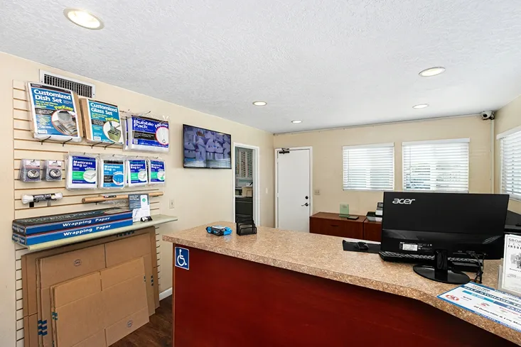 Main office of a storage facility with a desk.