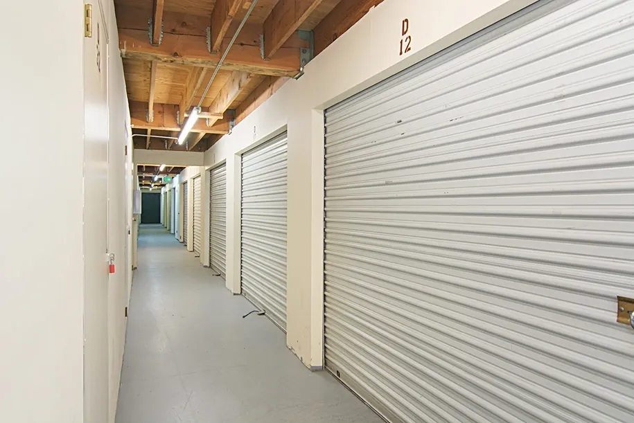 Hallway with indoor white storage units.