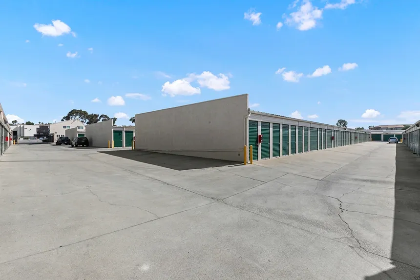 Large road near drive up self storage units.