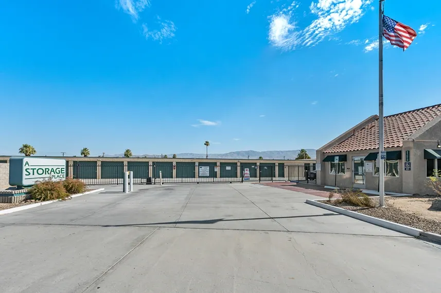 Wide view of a storage facility gate and office.