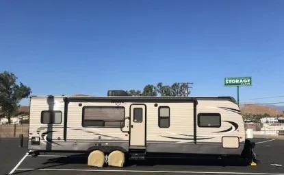 RV storage in a parking lot.